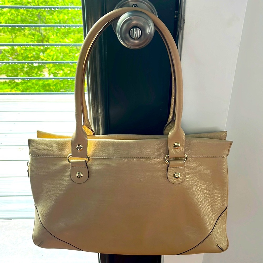 Kate Spade cream and gold leather purse with three inner sections